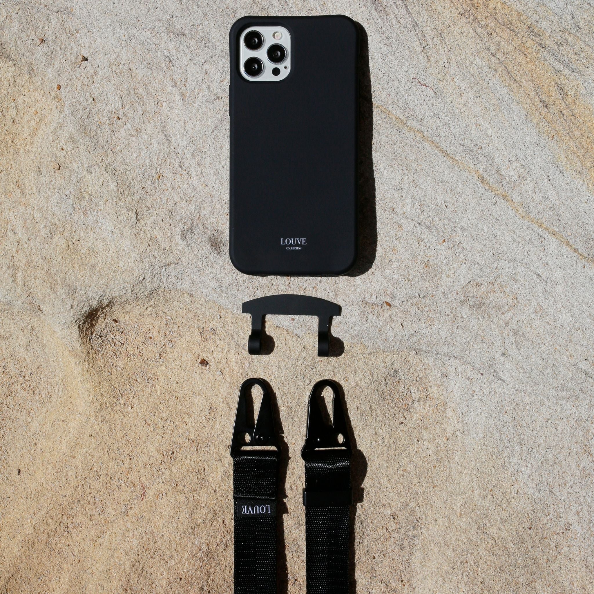 Phone case with cord. Corded phone cases. Customise your phone. custom phone accessories. Mobile cords. Phone strap. TDE The Daily Edited. maison de sabre. xouxou. phone lanyard. iphone straps. Samsung. Casetify. Phone accessory. phone chain. Black