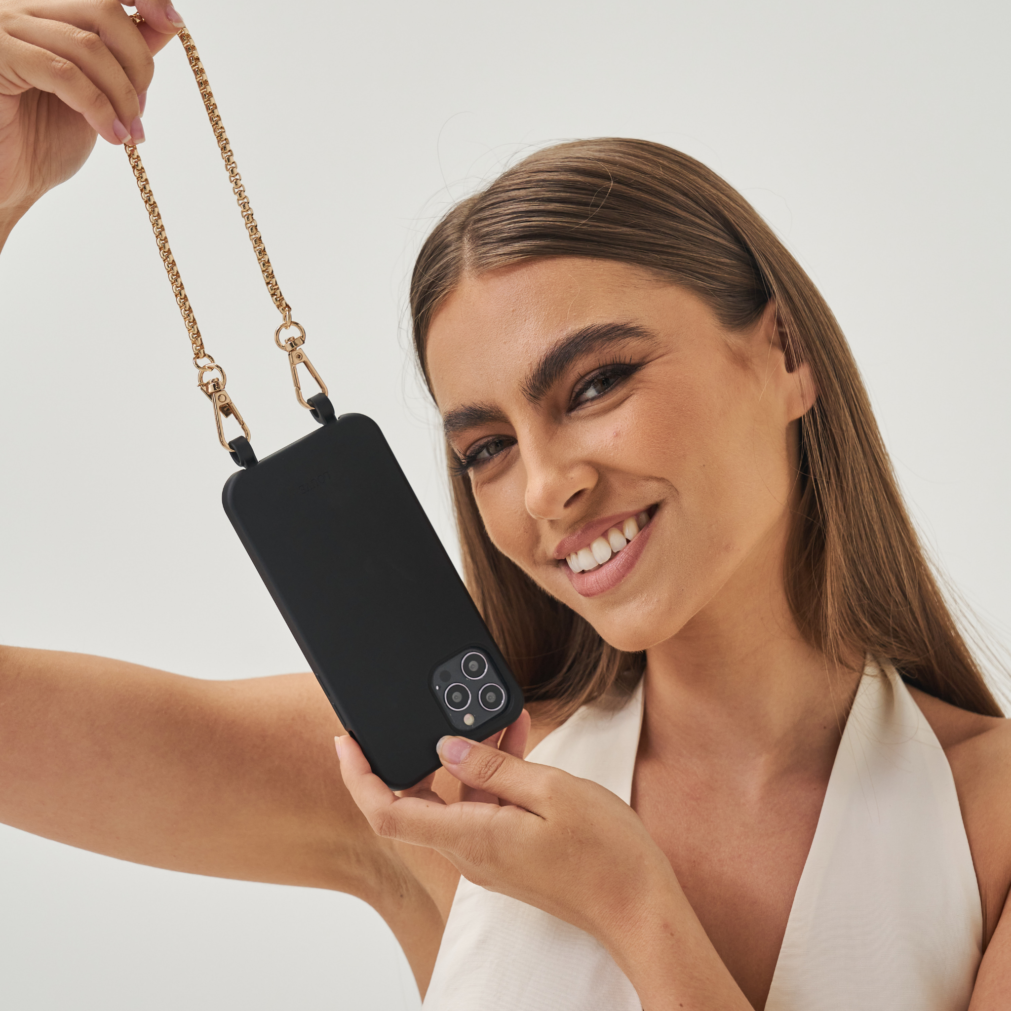 Crossbodyphonecase.PhonecasewithLanyard.Smartphonestrap.Phone-purse.Phonechainpearls.PearlPhoneBracelet.Wristlet.BandolierStyle.Casetify.Carrie-Case.Thedailyedited.Mimco.Luxuryphon