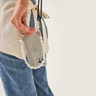 Crossbody smartphone case. Phone accessory. Phone case strap. Phone Harness. Lanyard. Phone-bag. Pearl Phone chain. Phone-Bracelet. Wristlet. Maison de sabre. Bandolier Style. Ideal of Sweden. Carrie-Case. The daily edited. Mimco. Luxury iphone case.9