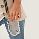 Crossbody smartphone case. Phone accessory. Phone case strap. Phone Harness. Lanyard. Phone-bag. Pearl Phone chain. Phone-Bracelet. Wristlet. Maison de sabre. Bandolier Style. Ideal of Sweden. Carrie-Case. The daily edited. Mimco. Luxury iphone case.9