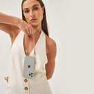 Crossbody smartphone case. iPhone accessory. Phone case with strap. Phone Harness. Lanyard. Phone-bag. Pearl Phone chain. Phone-Bracelet. Wristlet. Maison de sabre. Bandolier Style. Ideal of Sweden. Carrie-Case. The daily edited. Mimco. Luxury iphone case.