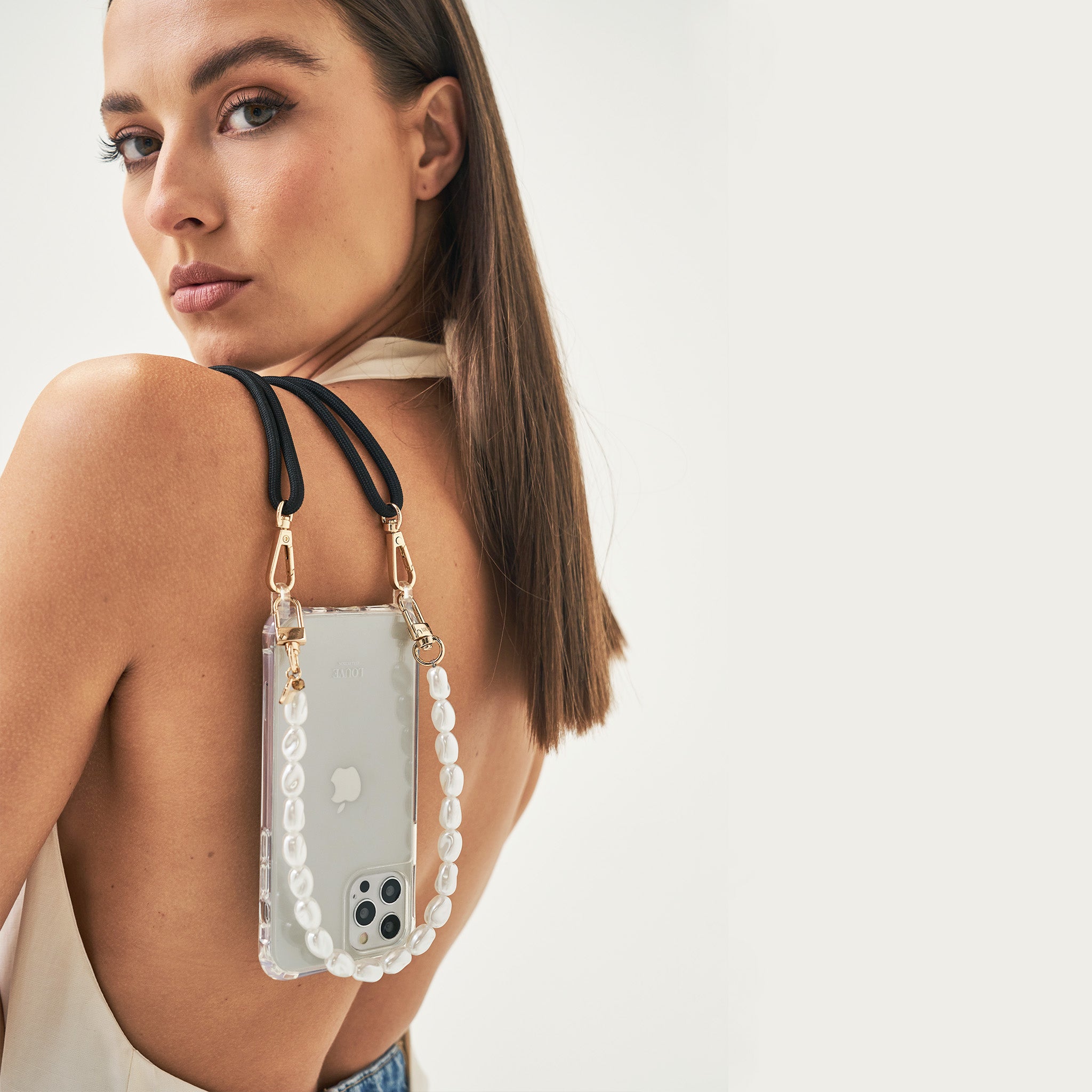 Crossbody smartphone case. Phone accessory. Phone case strap. Phone Harness. Lanyard. Phone-bag. Pearl Phone chain. Phone-Bracelet. Wristlet. Maison de sabre. Bandolier Style. Ideal of Sweden. Carrie-Case. The daily edited. Mimco. Luxury iphone case.9
