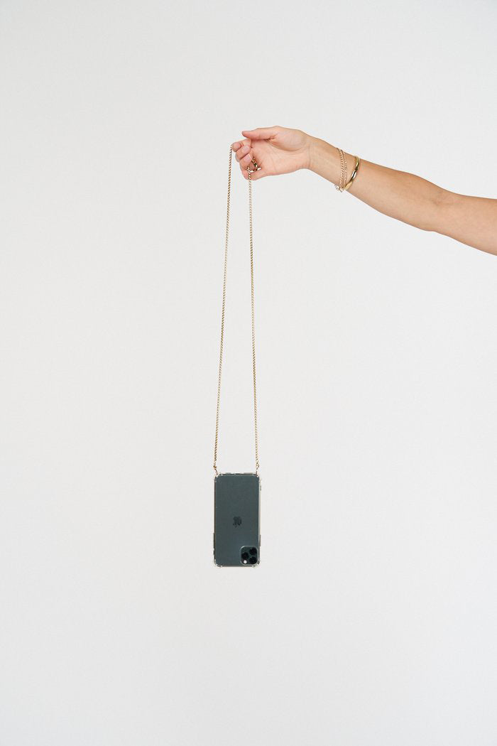 Crossbody phone case. Modular Smartphone cases. Phone Harness. Lanyard. Strap. Phone accessories. Xouxou. Casetify. Bandolier style. Tde. Corded phone case. Hands-free phone accessories. Phone necklace. Mini-bag. Gold phone chain. Phone chain gold-plating.
