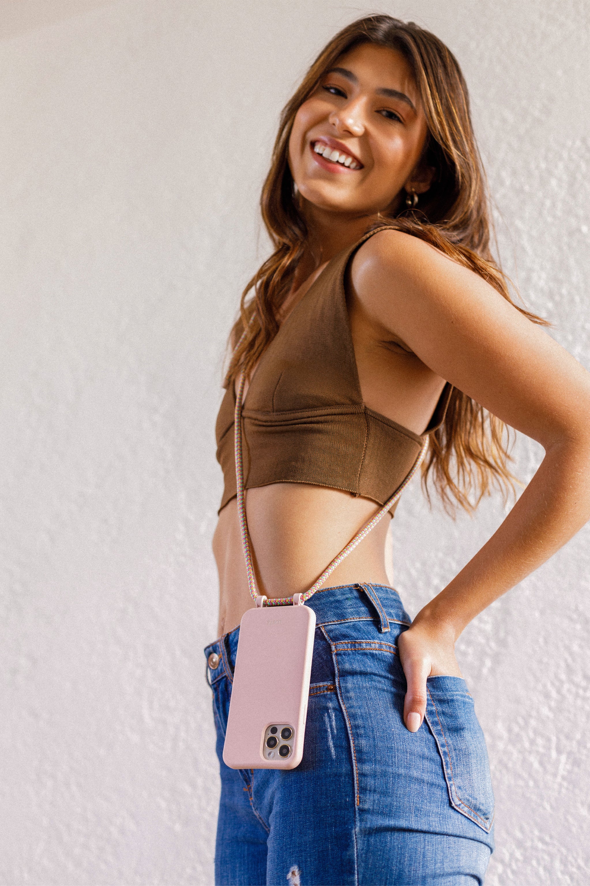 Crossbody phone case. Modular Smartphone cases. Phone Harness. Lanyard. Strap. Phone accessories. Xouxou. Casetify. Bandolier style. Tde. Corded phone case. Hands-free phone accessories. Phone necklace. Mini-bag. 