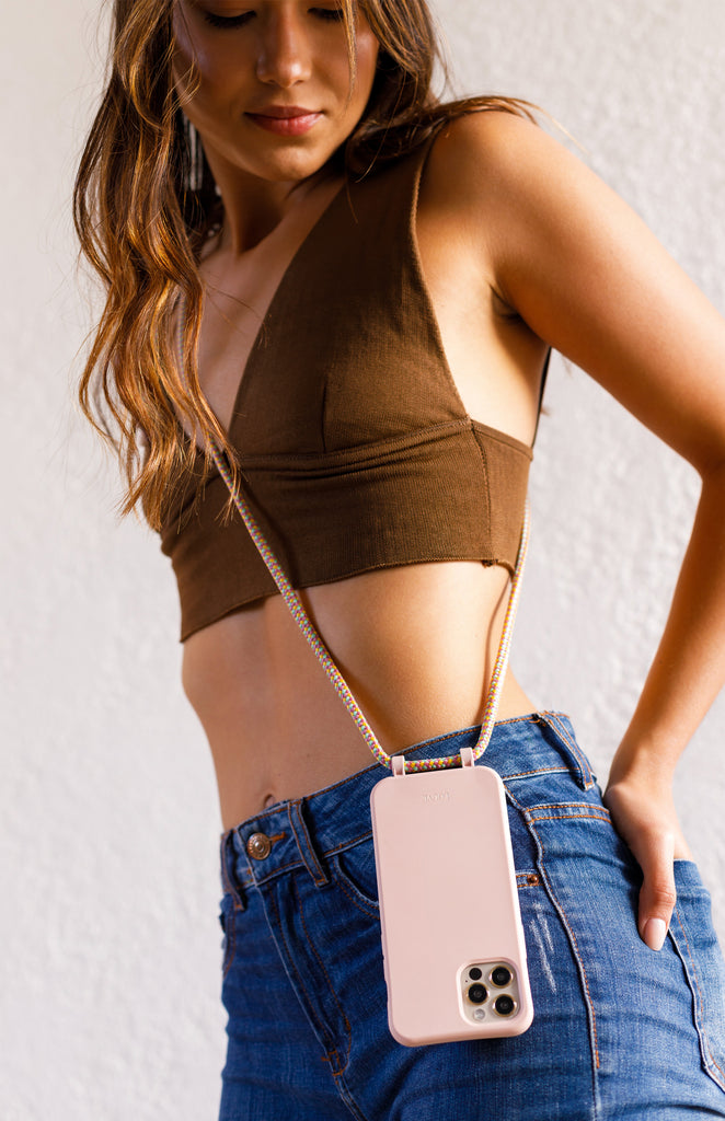 Crossbody phone case. Modular Smartphone cases. Phone Harness. Lanyard. Strap. Phone accessories. Xouxou. Casetify. Bandolier style. Tde. Corded phone case. Hands-free phone accessories. Phone necklace. Mini-bag. 