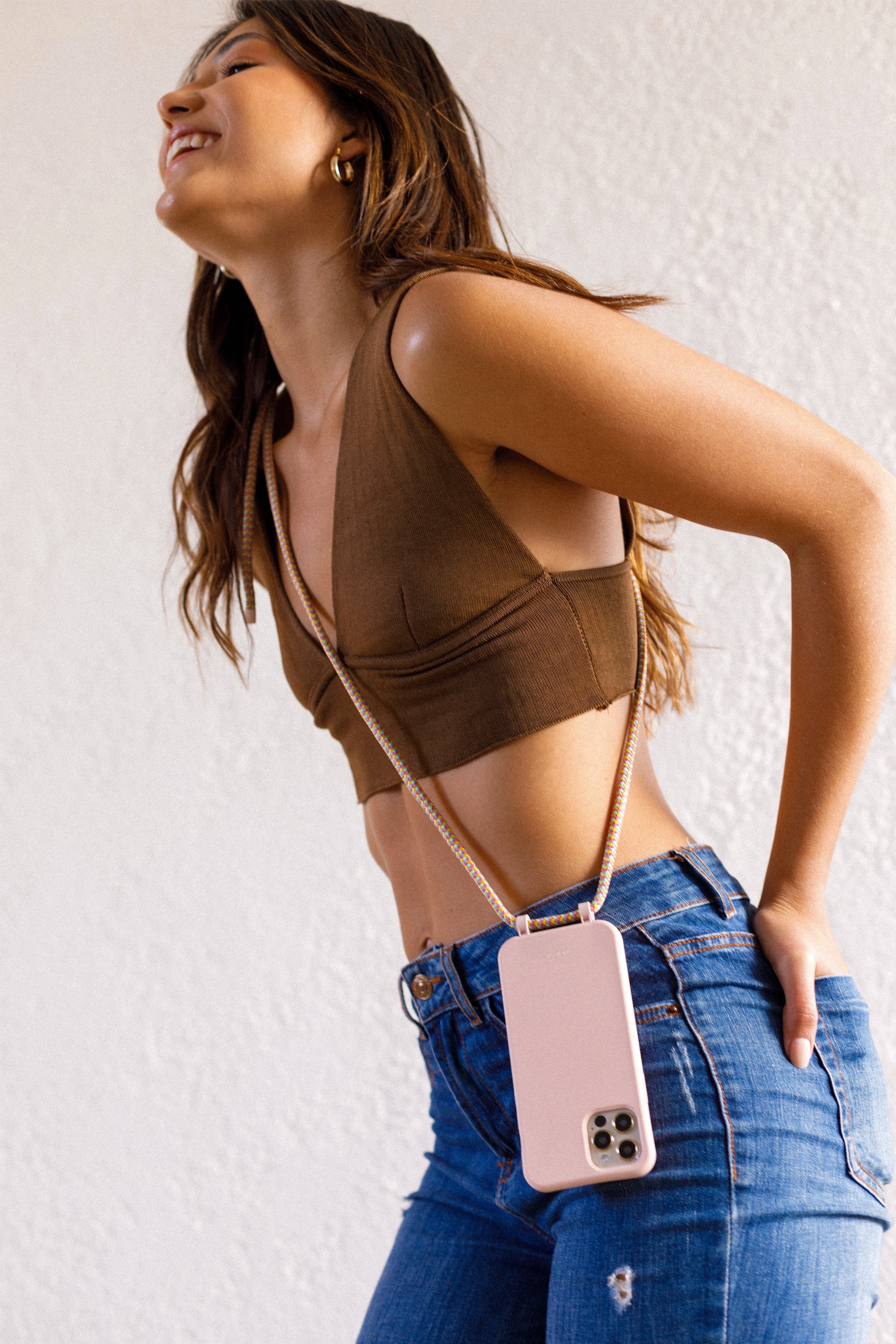 Crossbody phone case. Modular Smartphone cases. Phone Harness. Lanyard. Strap. Phone accessories. Xouxou. Casetify. Bandolier style. Tde. Corded phone case. Hands-free phone accessories. Phone necklace. Mini-bag. 