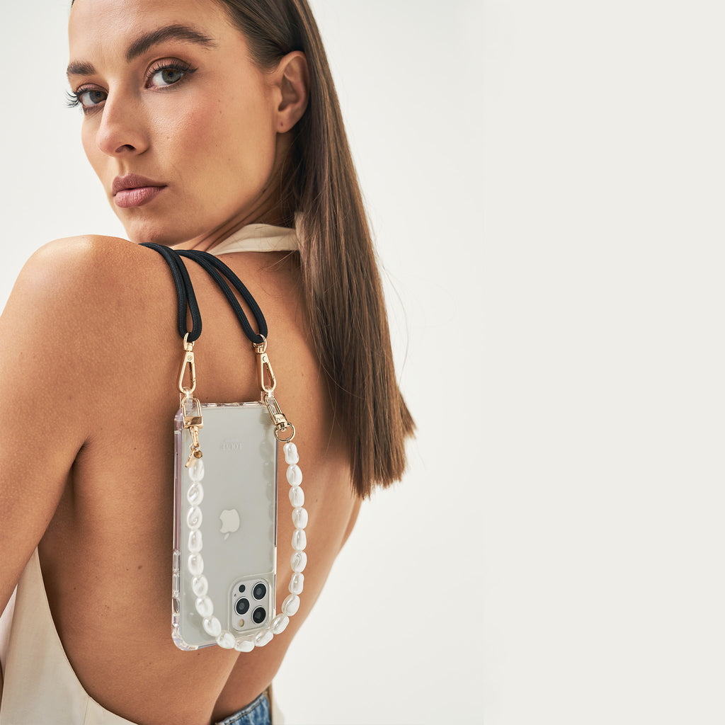 Crossbody smartphone case. Phone accessory. Phone case strap. Phone Harness. Lanyard. Phone-bag. Pearl Phone chain. Phone-Bracelet. Wristlet. Maison de sabre. Bandolier Style. Ideal of Sweden. Carrie-Case. The daily edited. Mimco. Luxury iphone case.9