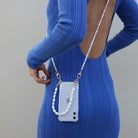 Crossbody phone case. Phone case with pearl strap. Emily in Paris. Ashley Park. Mindy. Pearly phone chain. Phone chain with pearls. Clear phone case. Custom smartphone accessories. Phone case with Pearl wristlet. pearl Chain for your phone. Phone lanyard with pearls. Double phone cord with pearls. Pearl phone bracelet. wristlet. wristband. phone Charm. phone Charms. phone Wristlets. modular phone case. iPhone straps. 13 pro max. mini. Lanyard. iPhone cords. mini phone bag. phone-necklace. Phone purse. 
