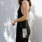 Phonecasewithcord.Cordedphonecase.Smartphonestrap.Lanyard.Modularphoneaccessories.Xouxou.Idealofsweden.Maisondesabre.carrie-case.string. phone case with strap. lanyard. xouxou. phone cords. Modular phone cases. bandolier style. ideal of Sweden. 